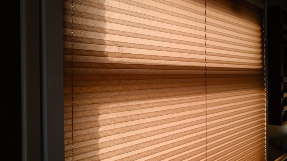 Modern smart blinds and custom drapes in a living room